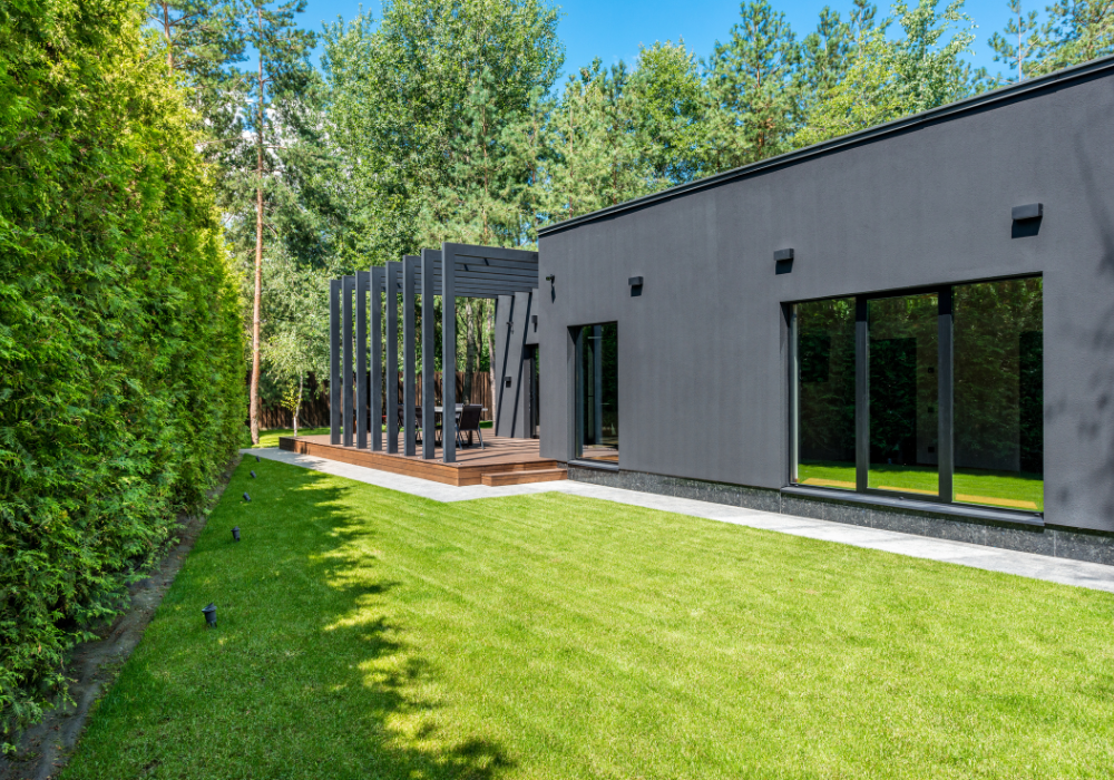 black house with small lawn