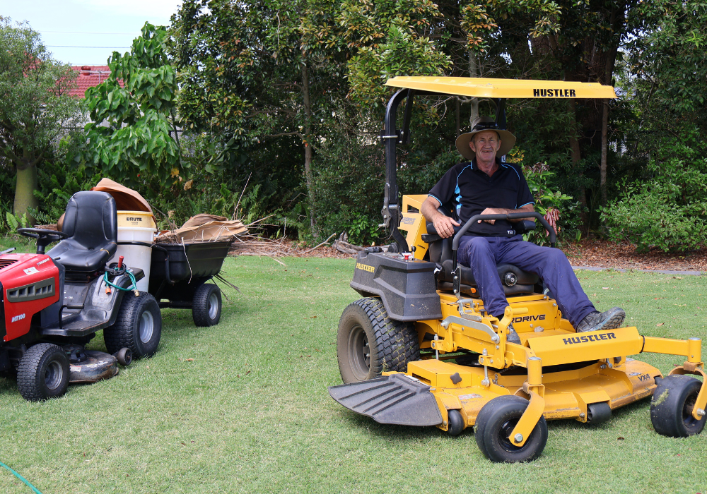 Groundskeeper Eric on his ride on mower