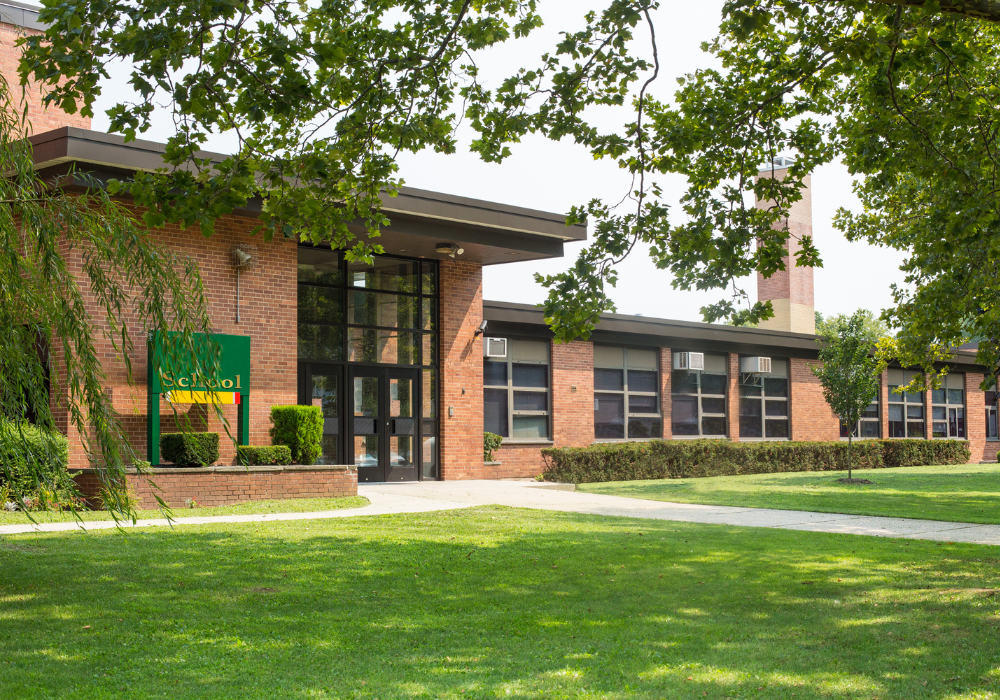 school building in a green environment