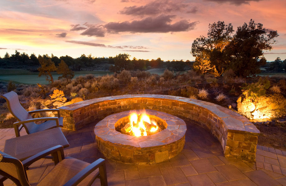 Landscaped fire pit lit with a view over forested area for fire pits Brisbane