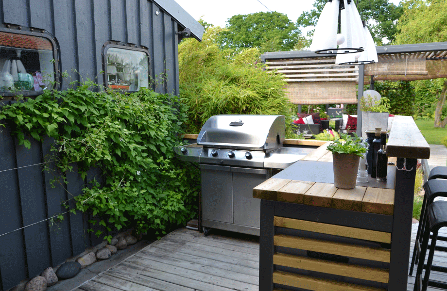 gorgeous bbq area with greenery and wooden features for garden decor