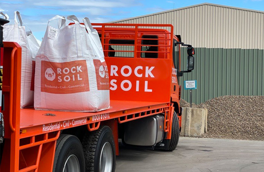 image of rock n soil bulk bags white with orange writing on the orange rock n soil truck