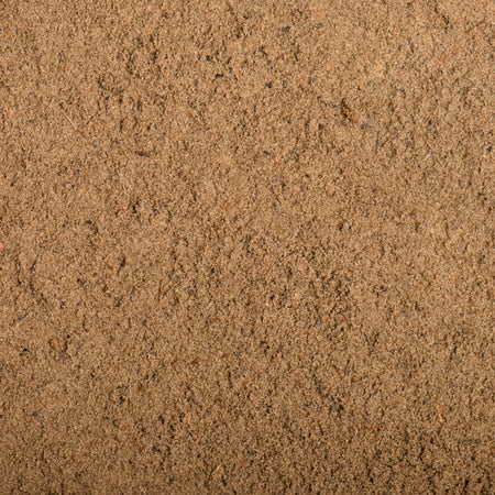 Close-up of sand with a brown color