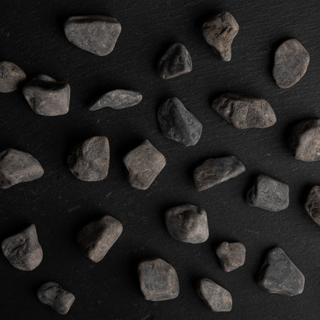Scattered stones on a dark surface