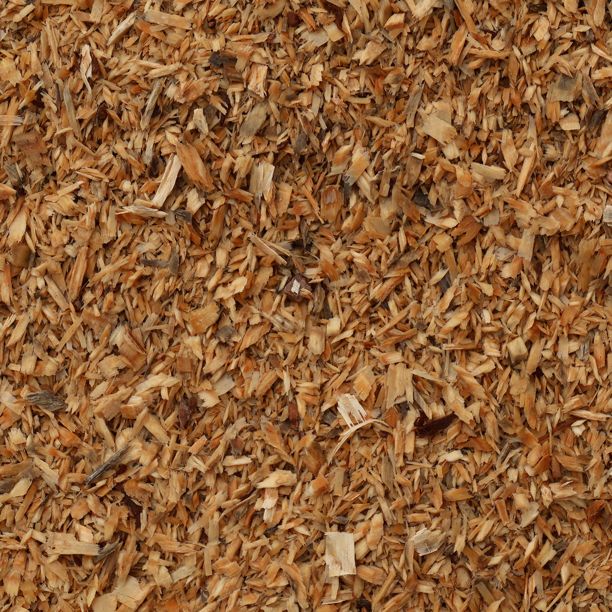 Close-up of wood chips or mulch with a brown color.