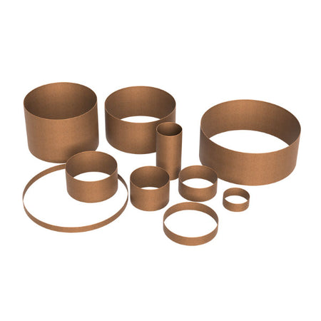 Set of bronze metal rings on a white background