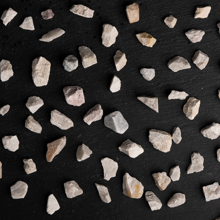 Small stones scattered on a black background