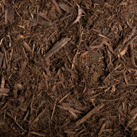 Close-up of brown mulch with small sticks and leaves