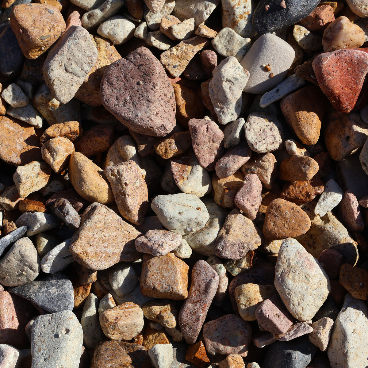 Bellagio Brisbane Tuff Stone Pebbles, 20-50mm, natural rock decor with rounded, textured pebbles for landscaping and garden use.