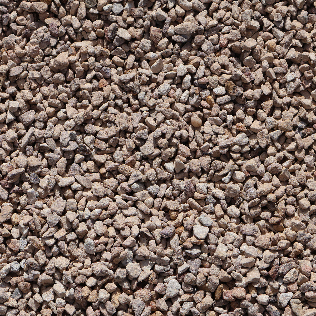 A close-up of Ablatio Crushed Sandstone rocks, 8-12mm size, showing natural crushed stone texture from Rock n Soil.