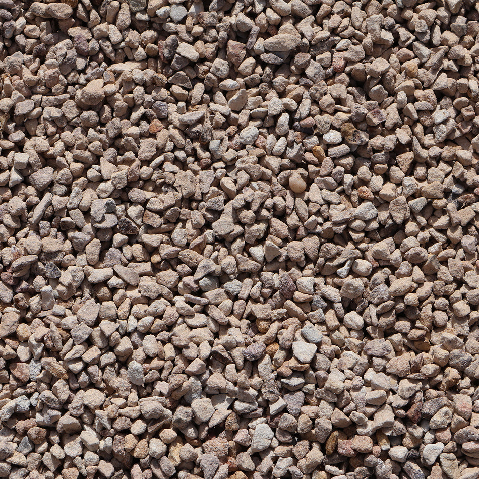 A close-up of Ablatio Crushed Sandstone rocks, 8-12mm size, showing natural crushed stone texture from Rock n Soil.