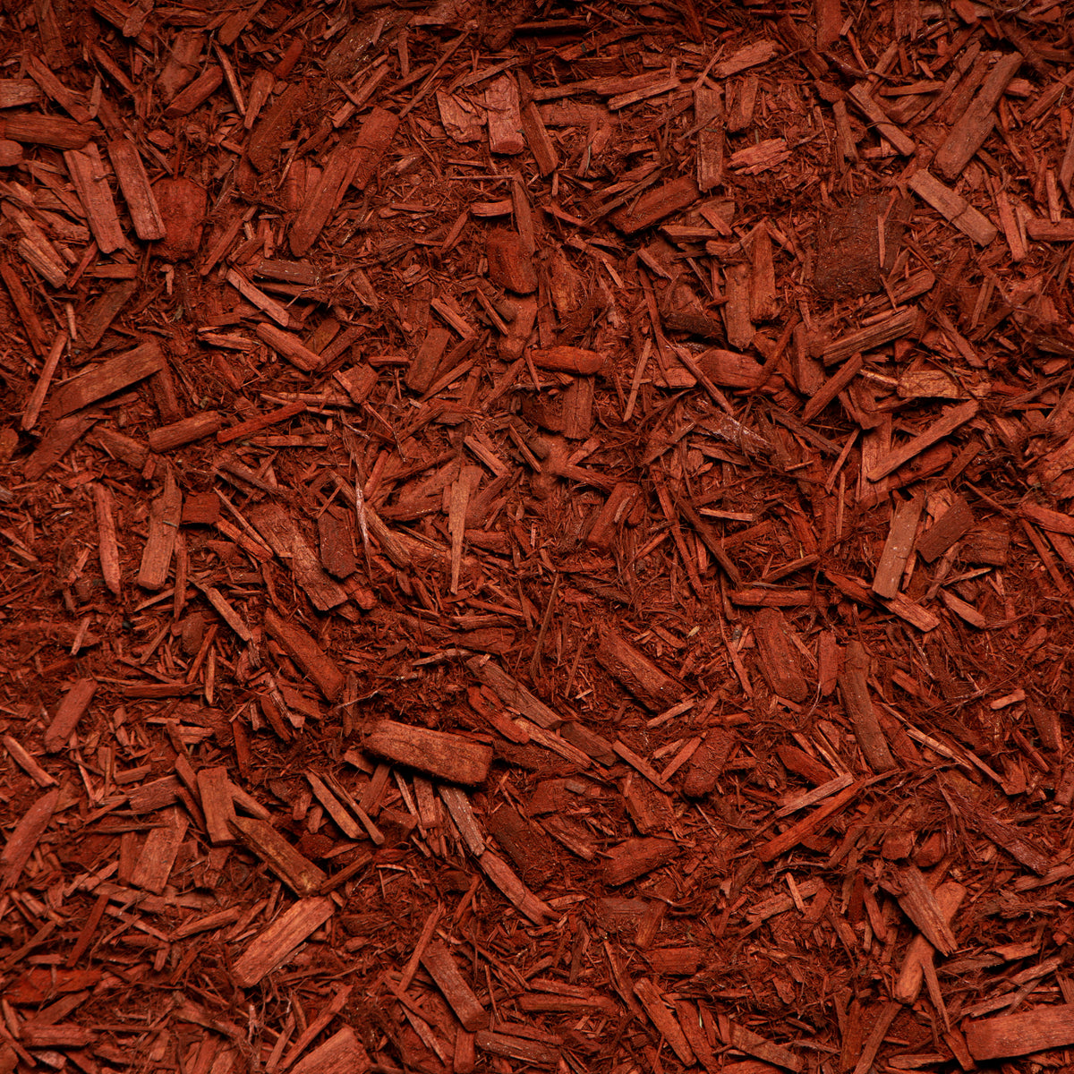 Close-up of red mulch with a textured pattern