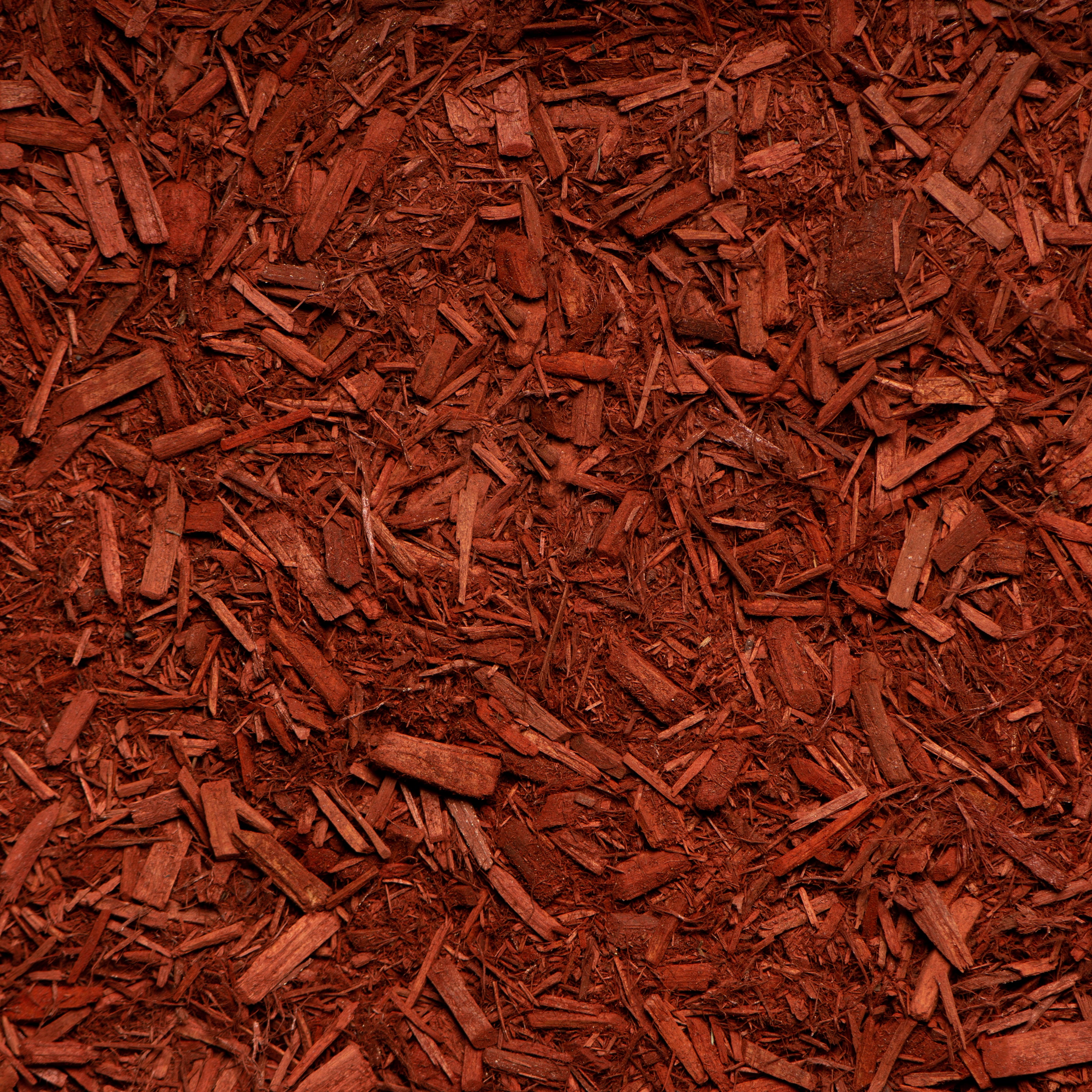 Close-up of red mulch with a textured pattern