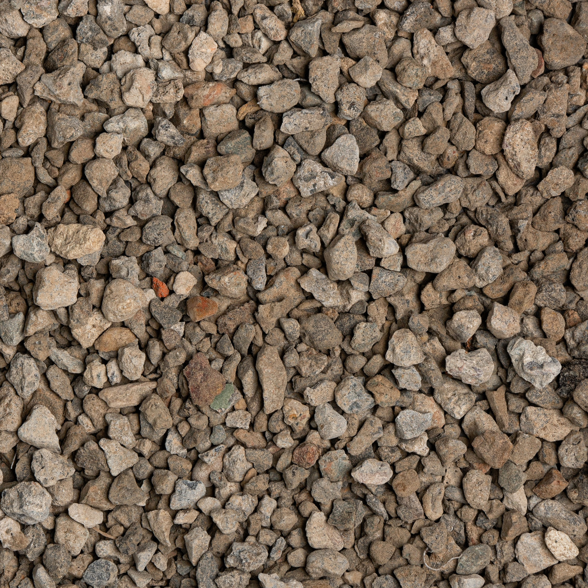 Close-up of small gravel stones with various shades of brown and gray.