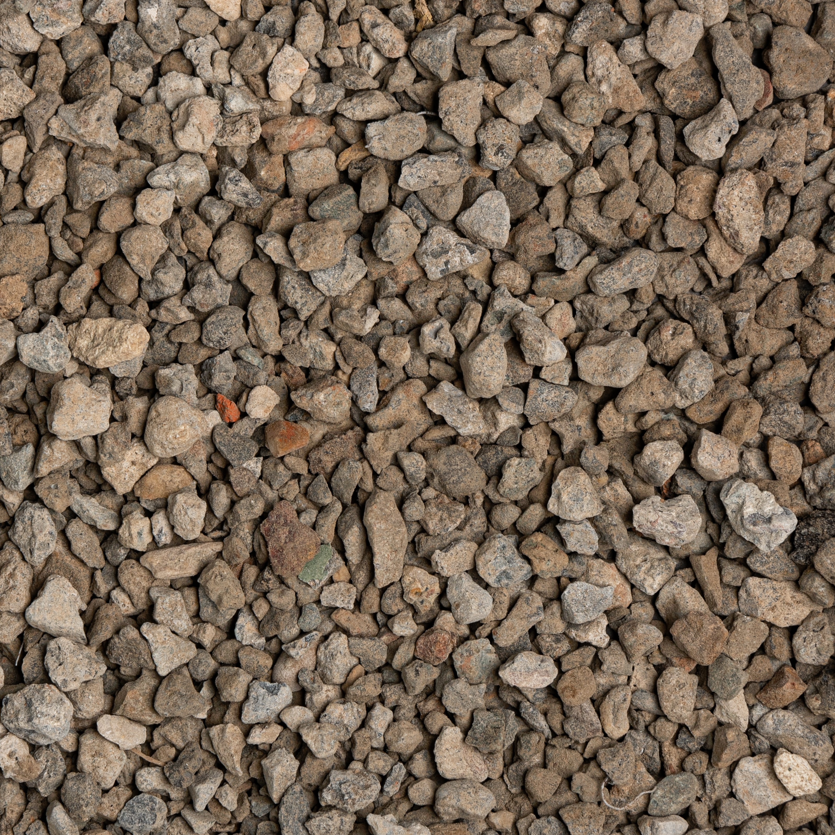 Close-up of small gravel stones with various shades of brown and gray.