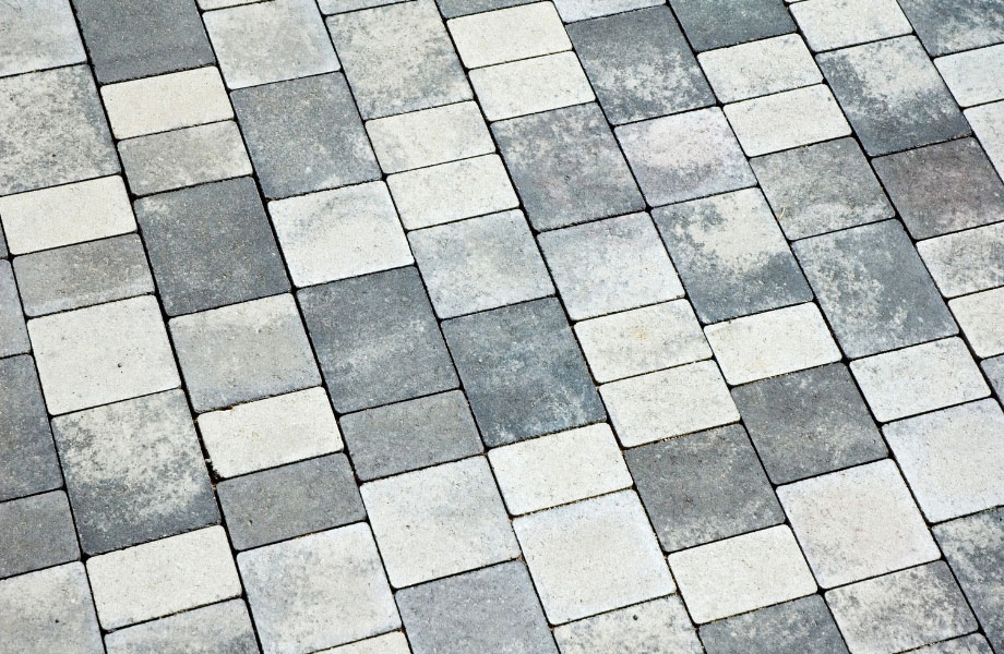 image of cleaned gray and white pavers for masonry maintenance 