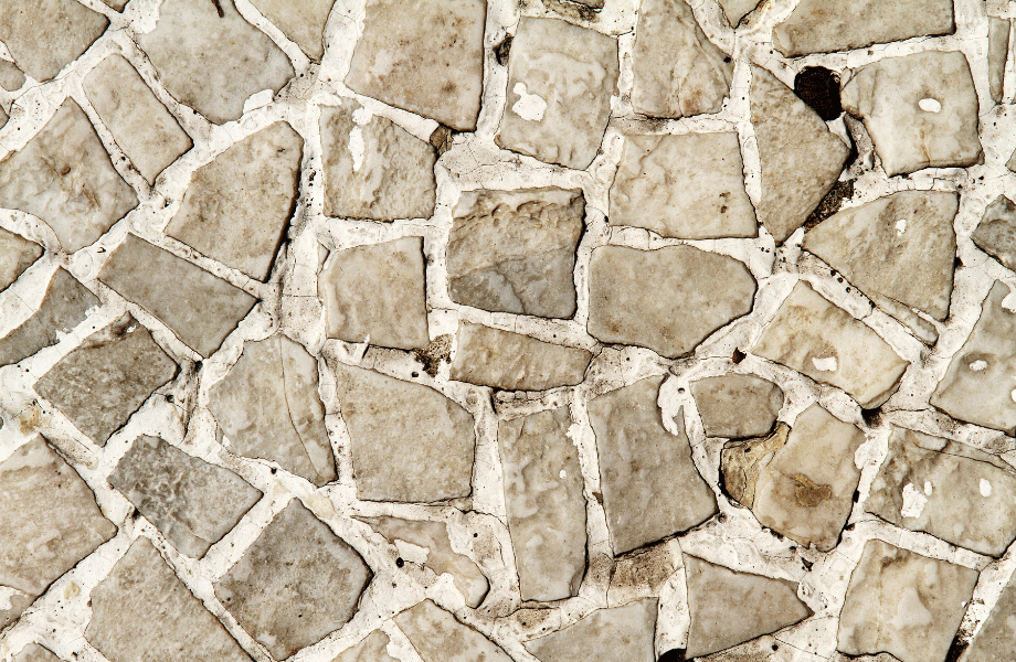 close up view of light grey cobblestone paving