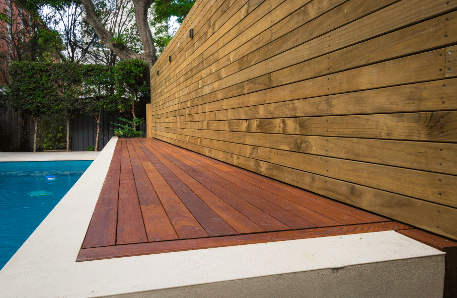 pool area with timber accents in the fencing and decking